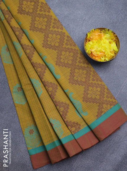 Nithyam cotton saree mustard shade and maroon with allover checked pattern & thread buttas and simple border