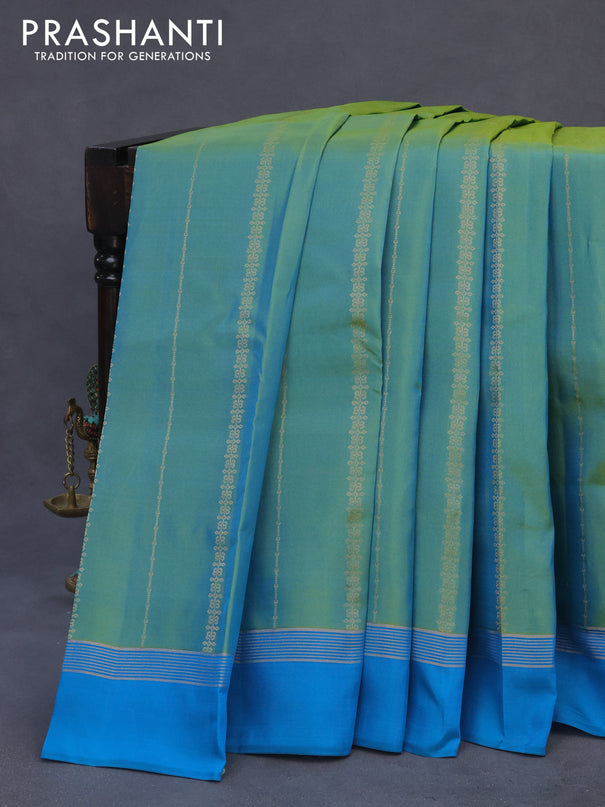 Kanchipuram silk saree dual shade of teal blue and cs blue with alllover zari weaves and zari woven simple border