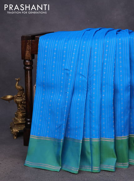 Kanchipuram silk saree cs blue and dual shade of green with allover zari weaves and rettapet zari woven border