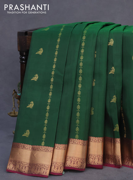 Kanchipuram silk saree dark green and purple with allover zari weaves & buttas and rich zari woven border