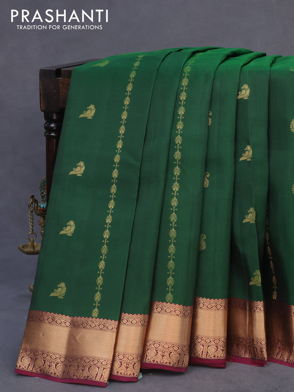 Kanchipuram silk saree dark green and purple with allover zari weaves & buttas and rich zari woven border