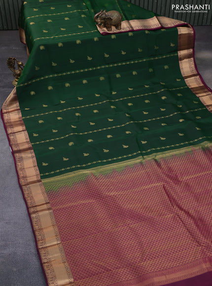 Kanchipuram silk saree dark green and purple with allover zari weaves & buttas and rich zari woven border