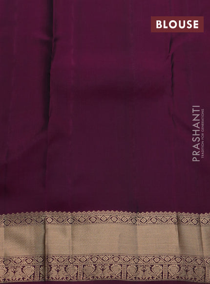 Kanchipuram silk saree dark green and purple with allover zari weaves & buttas and rich zari woven border