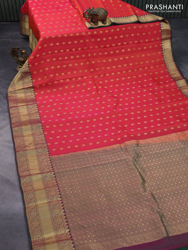 Kanchipuram silk saree dual shade of orange and dual shade of green with allover zari woven buttas and long zari woven border