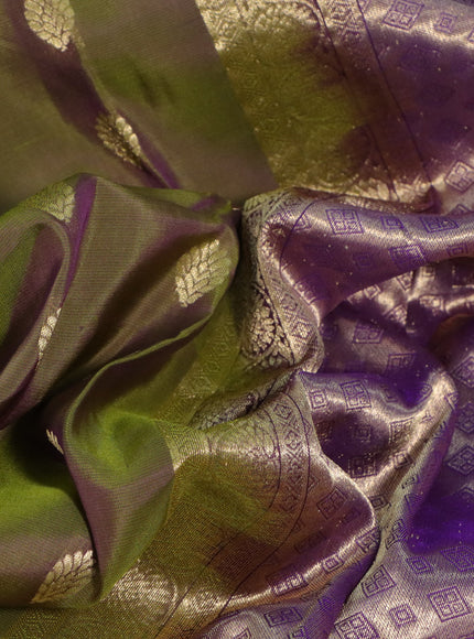 Kanchipuram silk saree dual shade of sap green and violet with allover zari woven buttas and long zari woven border