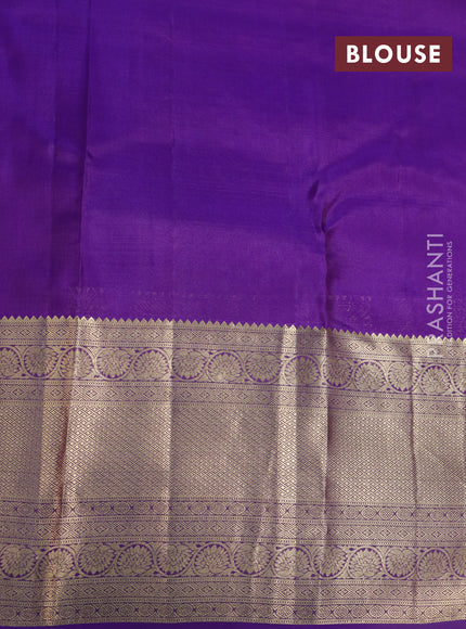 Kanchipuram silk saree dual shade of sap green and violet with allover zari woven buttas and long zari woven border