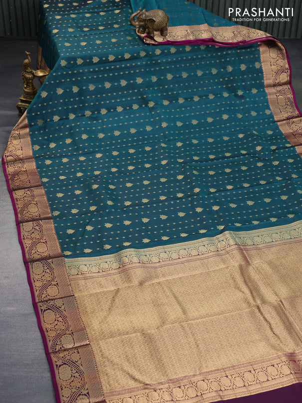 Kanchipuram silk saree peacock green and magenta pink with allover zari woven buttas and floral zari woven border