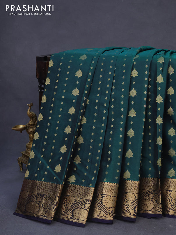 Kanchipuram silk saree peacock green and navy blue with allover zari woven buttas and floral zari woven border