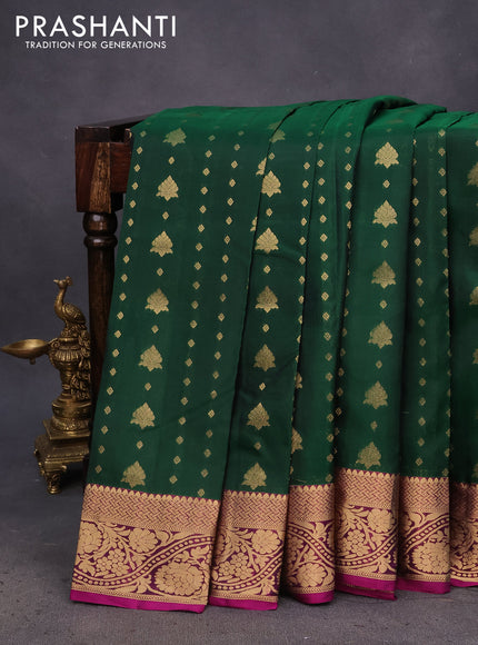 Kanchipuram silk saree dark green and dark magenta pink with allover zari woven buttas and floral zari woven border