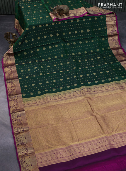 Kanchipuram silk saree dark green and dark magenta pink with allover zari woven buttas and floral zari woven border