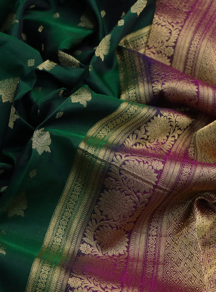 Kanchipuram silk saree dark green and dark magenta pink with allover zari woven buttas and floral zari woven border