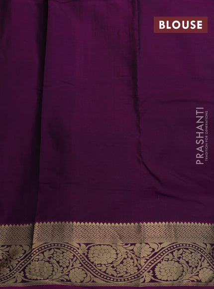 Kanchipuram silk saree dark green and dark magenta pink with allover zari woven buttas and floral zari woven border