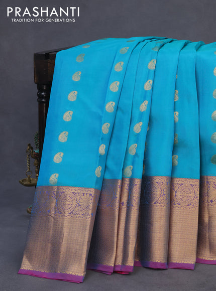 Kanchipuram silk saree teal blue and pink with paisley zari woven buttas and annam zari woven border