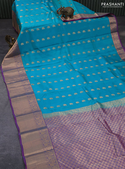 Kanchipuram silk saree teal blue and pink with paisley zari woven buttas and annam zari woven border