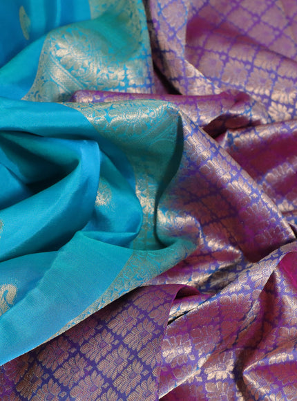 Kanchipuram silk saree teal blue and pink with paisley zari woven buttas and annam zari woven border