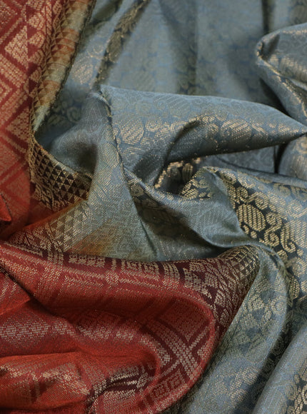 Kanchipuram silk saree rust shade and grey with allover silver zari woven brocade weaves and rettapet zari woven border