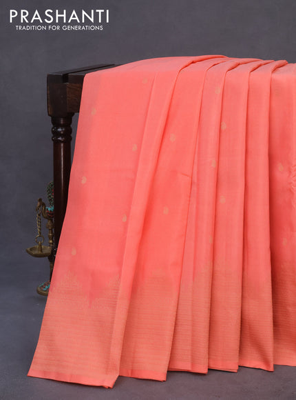 Kanchipuram silk saree peach pink and dark green with paisley zari woven buttas and temple design zari woven border