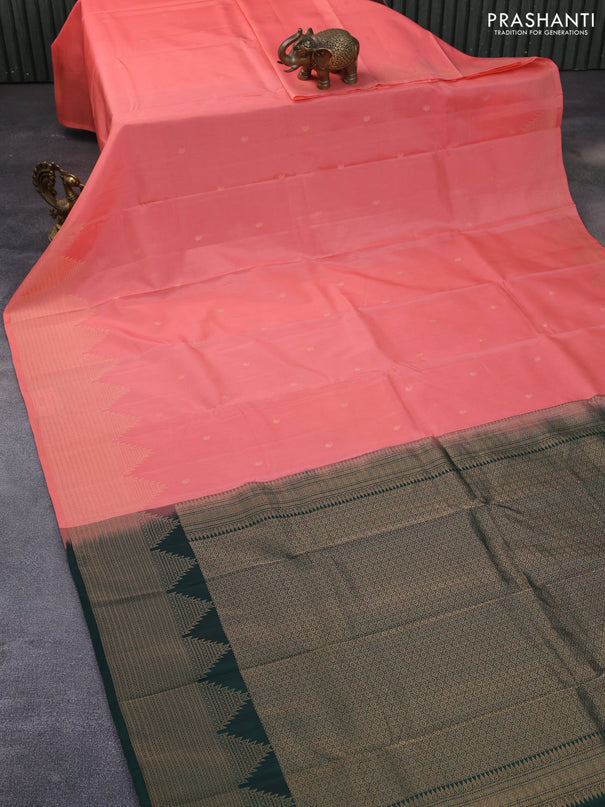 Kanchipuram silk saree peach pink and dark green with paisley zari woven buttas and temple design zari woven border