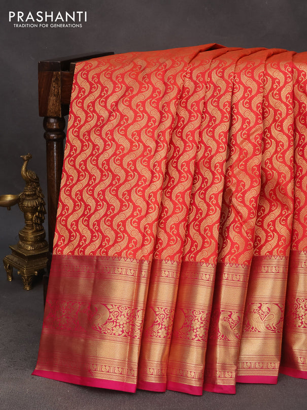 Pure kanchipuram silk saree dual shade of pinkish orange and pink with allover zari woven brocade weaves and long zari woven border