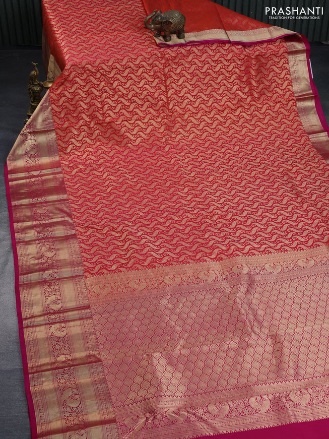 Pure kanchipuram silk saree dual shade of pinkish orange and pink with allover zari woven brocade weaves and long zari woven border