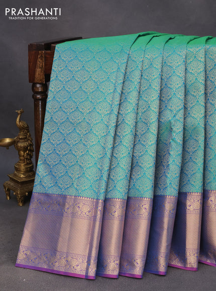 Pure kanchipuram silk saree dual shade of teal bulish green and pink with allover zari woven brocade weaves and zari woven border