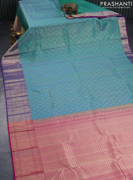 Pure kanchipuram silk saree dual shade of teal bulish green and pink with allover zari woven brocade weaves and zari woven border