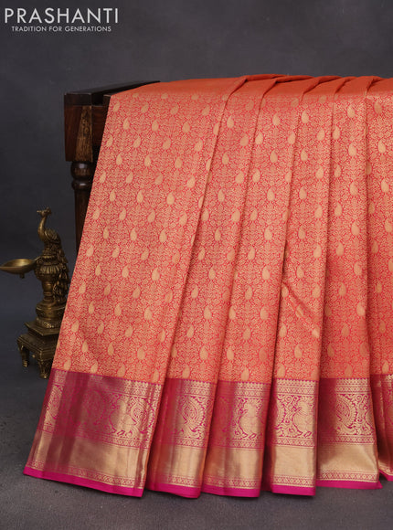 Pure kanchipuram silk saree dual shade of pinkish orange and pink with allover zari woven brocade weaves and annam zari woven border