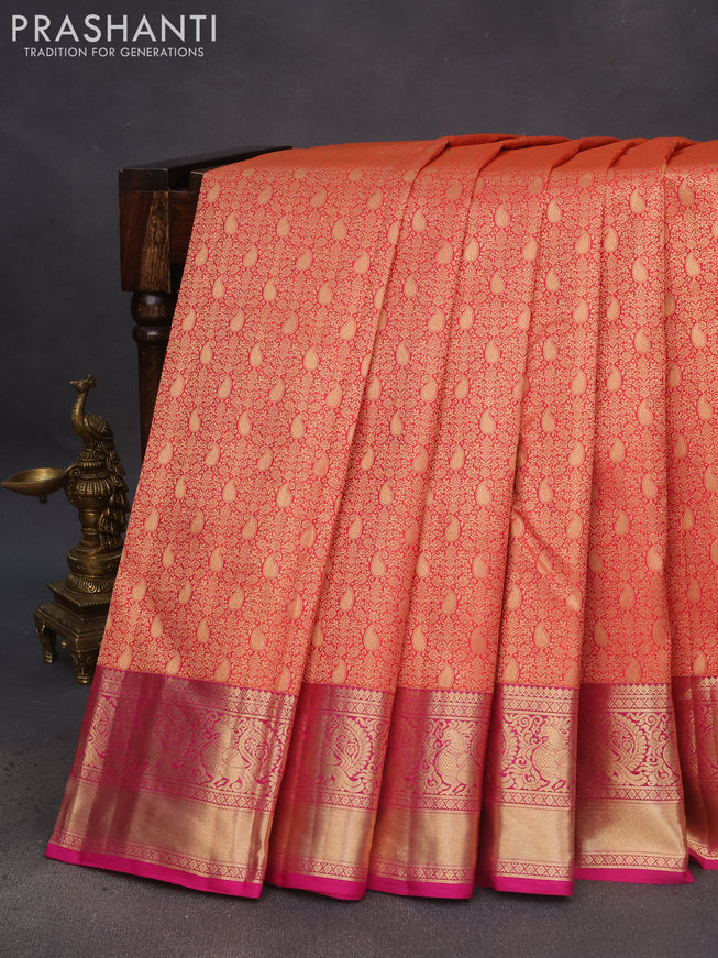 Pure kanchipuram silk saree dual shade of pinkish orange and pink with allover zari woven brocade weaves and annam zari woven border