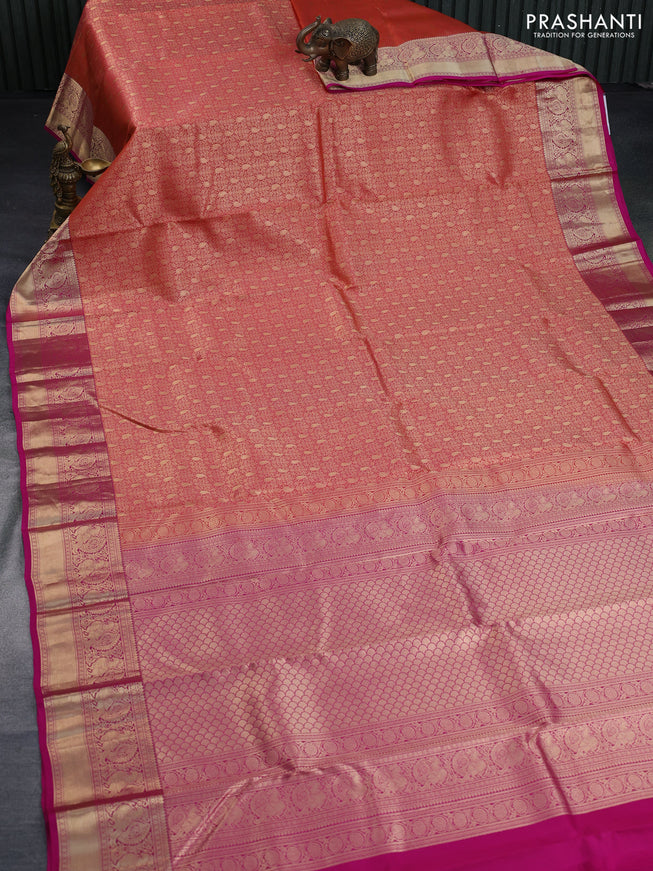 Pure kanchipuram silk saree dual shade of pinkish orange and pink with allover zari woven brocade weaves and annam zari woven border