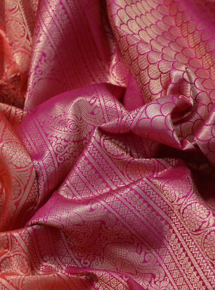 Pure kanchipuram silk saree dual shade of pinkish orange and pink with allover zari woven brocade weaves and annam zari woven border