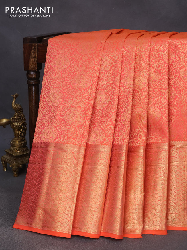 Pure kanchipuram silk saree dual shade of pinkish orange with allover zari woven brocade weaves and long annam zari woven border