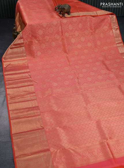 Pure kanchipuram silk saree dual shade of pinkish orange with allover zari woven brocade weaves and long annam zari woven border