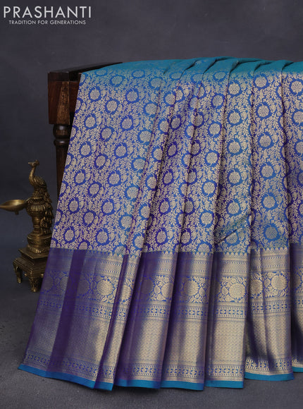 Pure kanchipuram silk saree dual shade of peacock blue with allover zari woven brocade weaves and long floral zari woven border