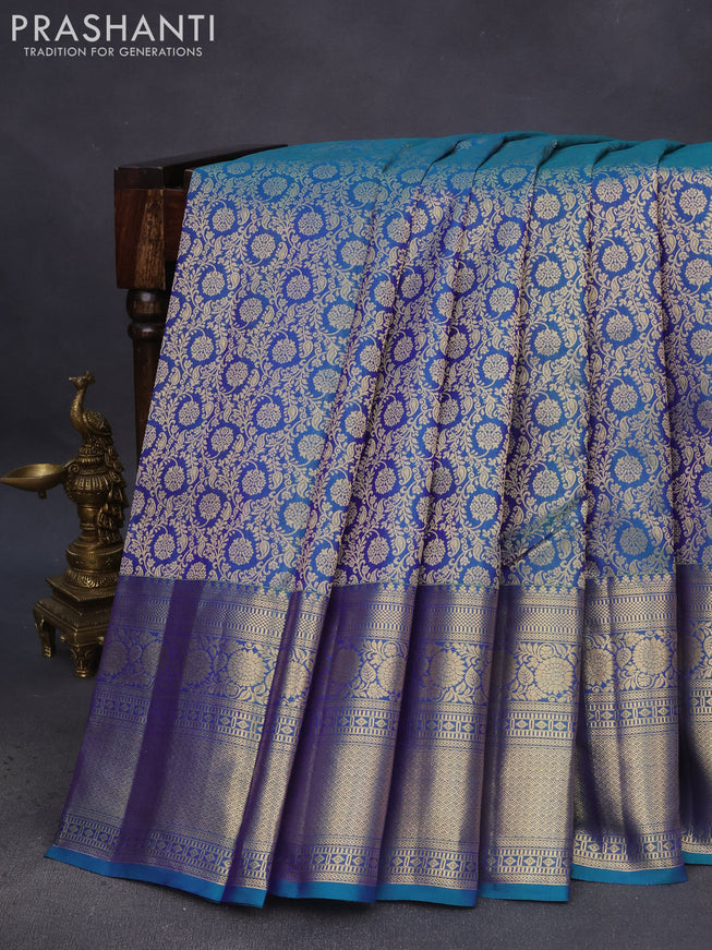 Pure kanchipuram silk saree dual shade of peacock blue with allover zari woven brocade weaves and long floral zari woven border