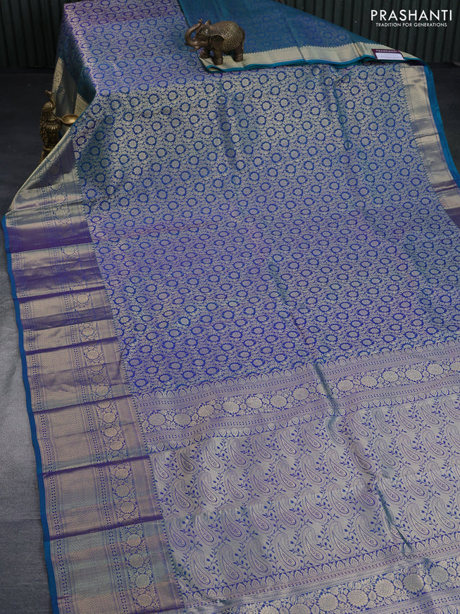 Pure kanchipuram silk saree dual shade of peacock blue with allover zari woven brocade weaves and long floral zari woven border