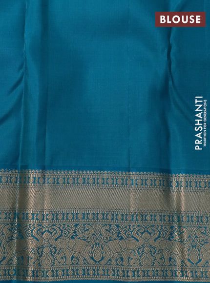 Pure kanchipuram silk saree dark magenta pink and teal blue with allover zari woven floral brocade weaves and zari woven korvai border