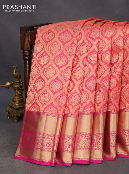 Pure kanchipuram silk saree dual shade of pinkish orange and pink with allover zari woven brocade weaves and zari woven border