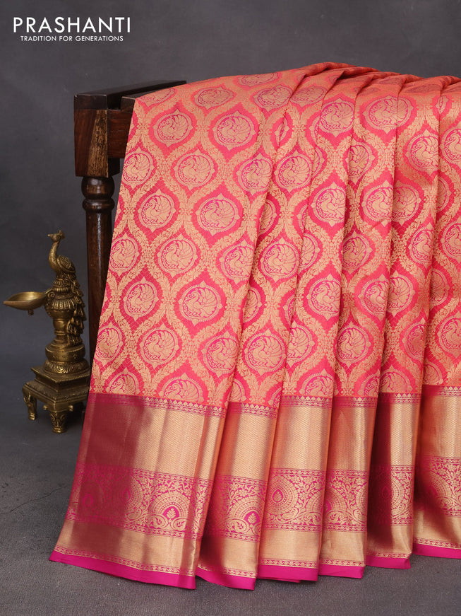 Pure kanchipuram silk saree dual shade of pinkish orange and pink with allover zari woven brocade weaves and zari woven border