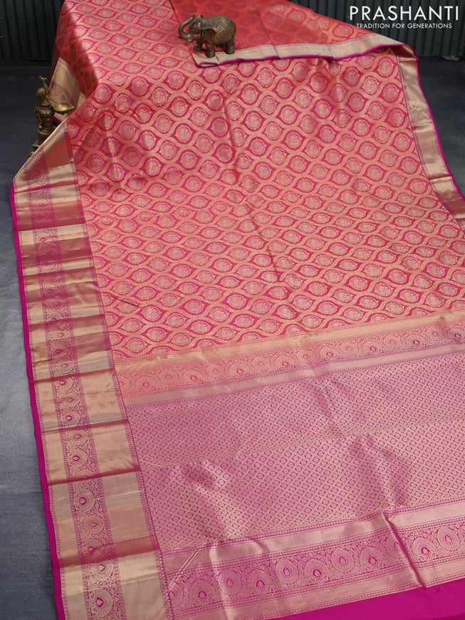 Pure kanchipuram silk saree dual shade of pinkish orange and pink with allover zari woven brocade weaves and zari woven border