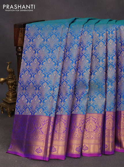 Pure kanchipuram silk saree dual shade of teal blue and purple with allover zari woven brocade weaves and zari woven border