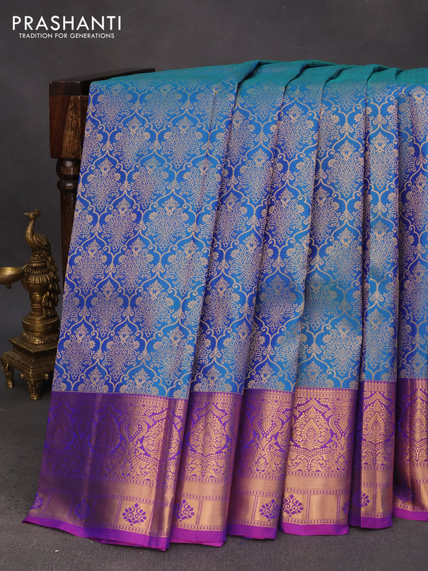 Pure kanchipuram silk saree dual shade of teal blue and purple with allover zari woven brocade weaves and zari woven border