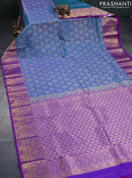 Pure kanchipuram silk saree dual shade of teal blue and purple with allover zari woven brocade weaves and zari woven border