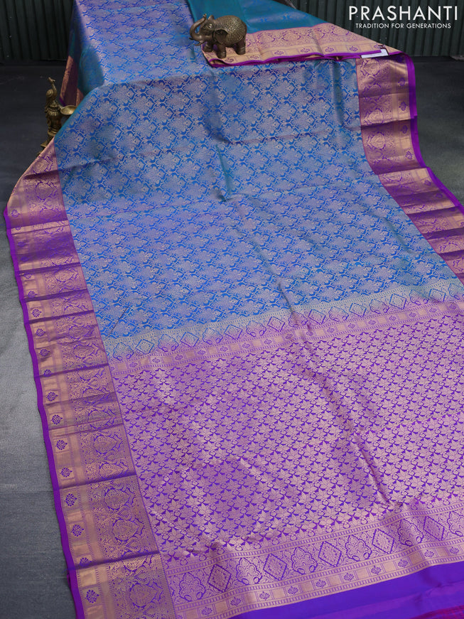 Pure kanchipuram silk saree dual shade of teal blue and purple with allover zari woven brocade weaves and zari woven border