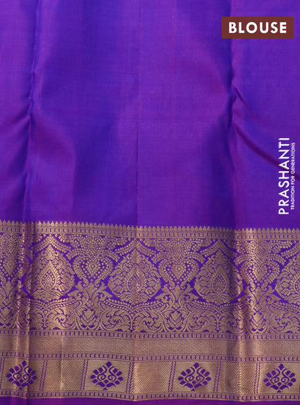 Pure kanchipuram silk saree dual shade of teal blue and purple with allover zari woven brocade weaves and zari woven border