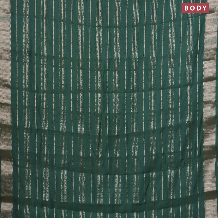 Assam silk saree green with allover zari woven stripes pattern and zari woven border