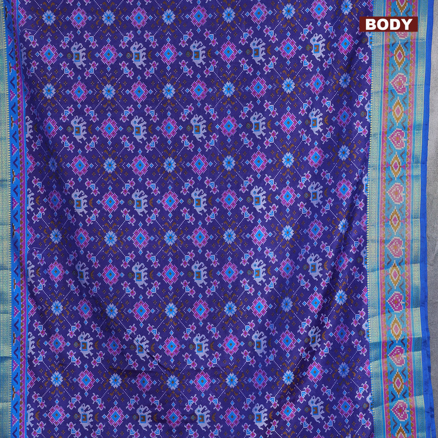 Semi tussar saree blue and cs blue with allover ikat prints and ikat woven zari border