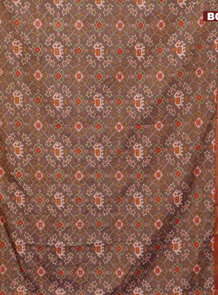 Semi tussar saree dual shade of brown and dual shade of rust with allover ikat prints and ikat woven zari border