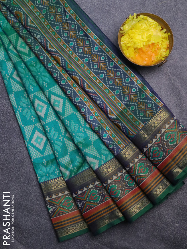 Semi tussar saree teal blue and dual shade of bluish green with allover ikat prints and ikat woven zari border