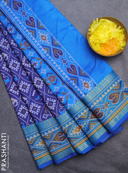 Semi tussar saree blue and cs blue with allover patola prints and ikat woven zari border