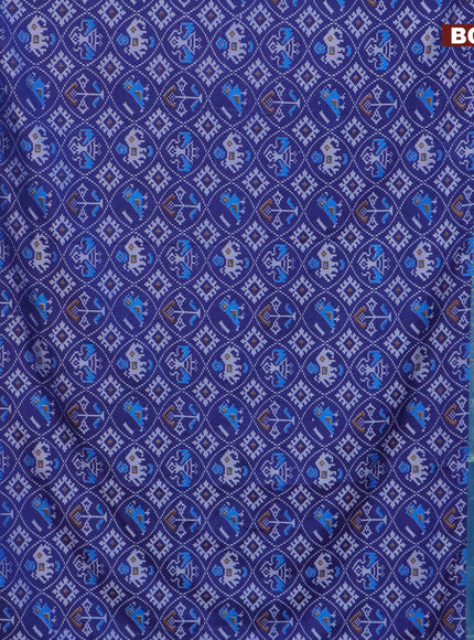 Semi tussar saree blue and cs blue with allover patola prints and ikat woven zari border